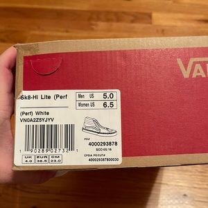 white and black high top vans